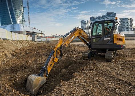 digging around foundation with mini excavator|digging with mini excavators.